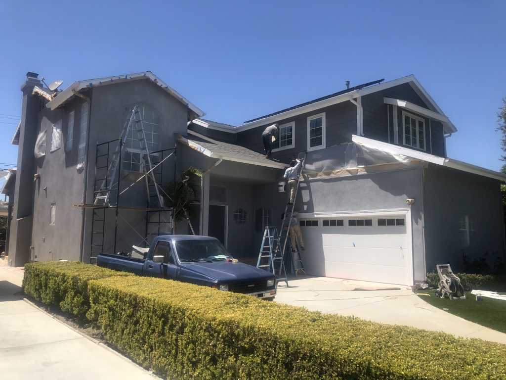 The exterior of a home being painted by Broshow Construction